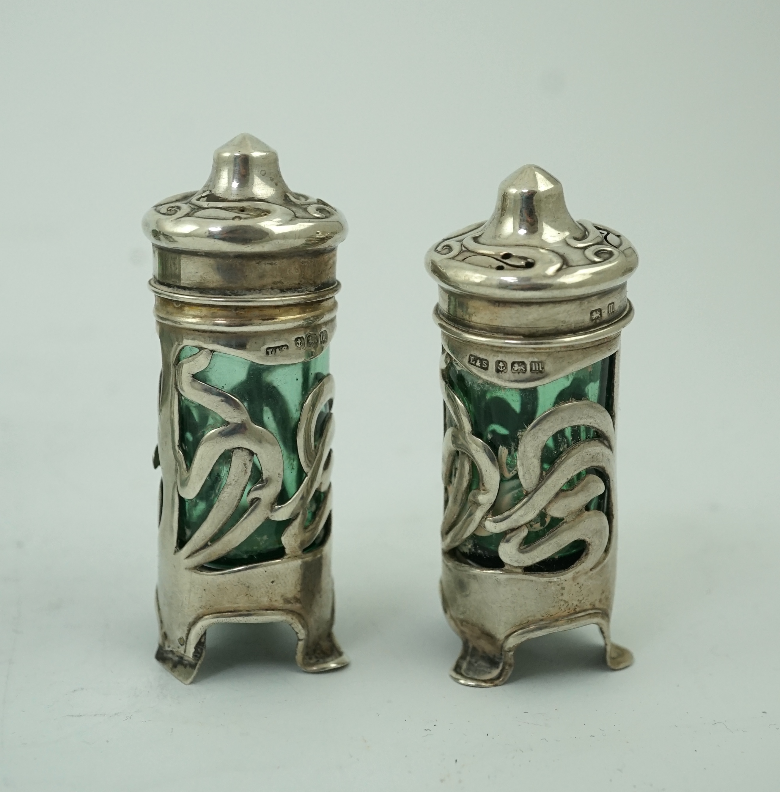 An early 20th century Art Nouveau pierced silver ten piece condiment set by Levy & Salaman